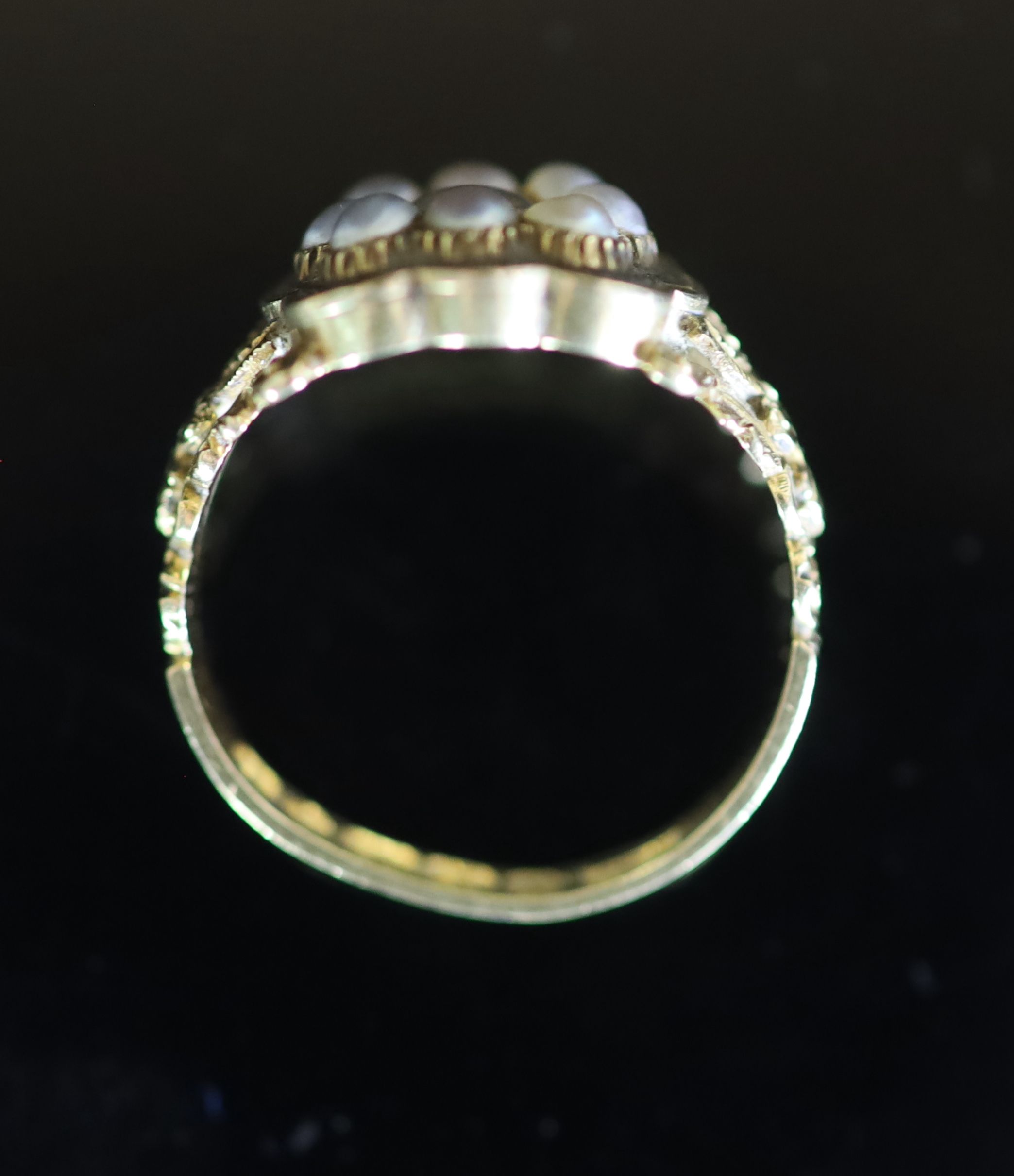 A William IV 18ct gold, black enamel and seed pearl set mourning ring